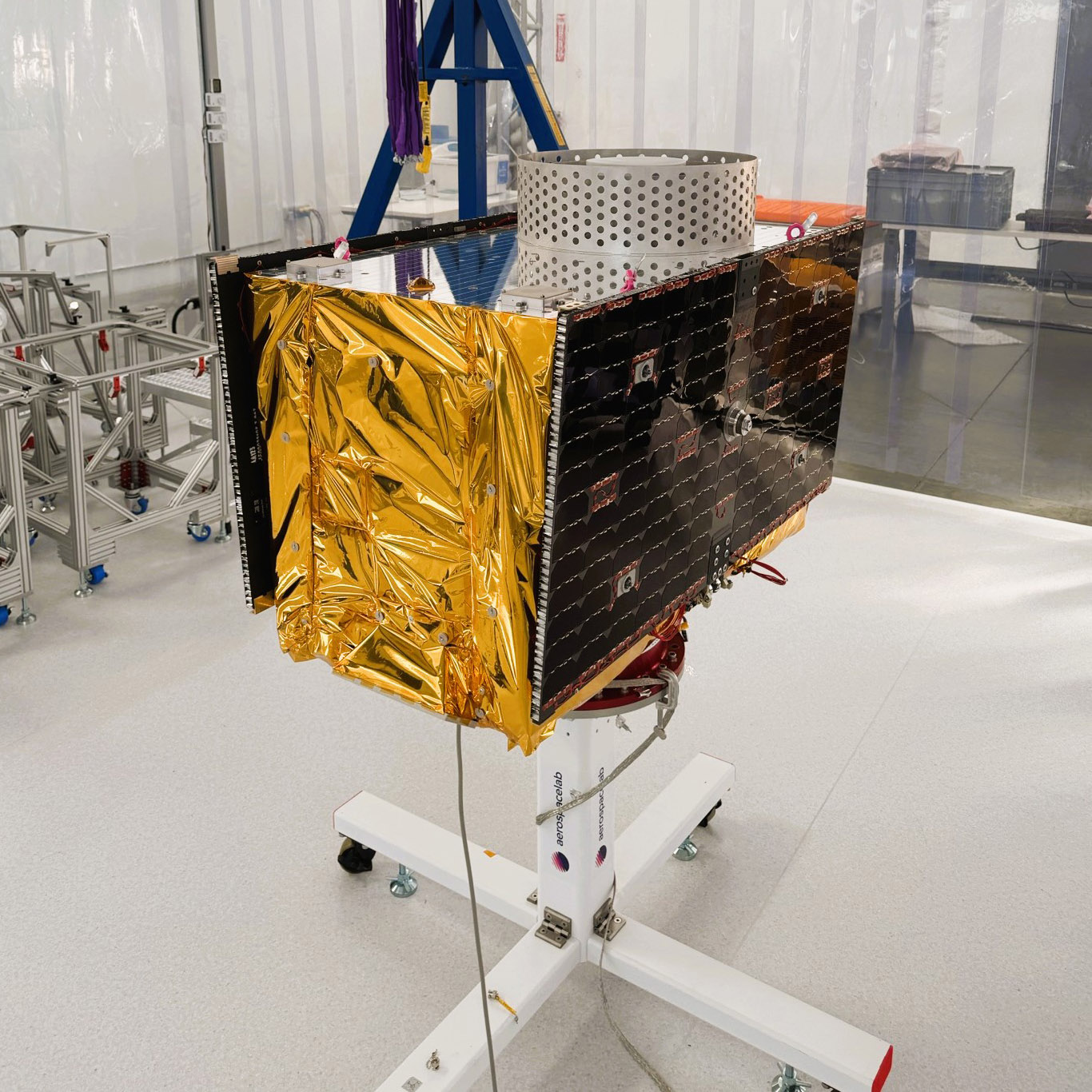 assembled GPS unit on a wheeled stand in a clean room