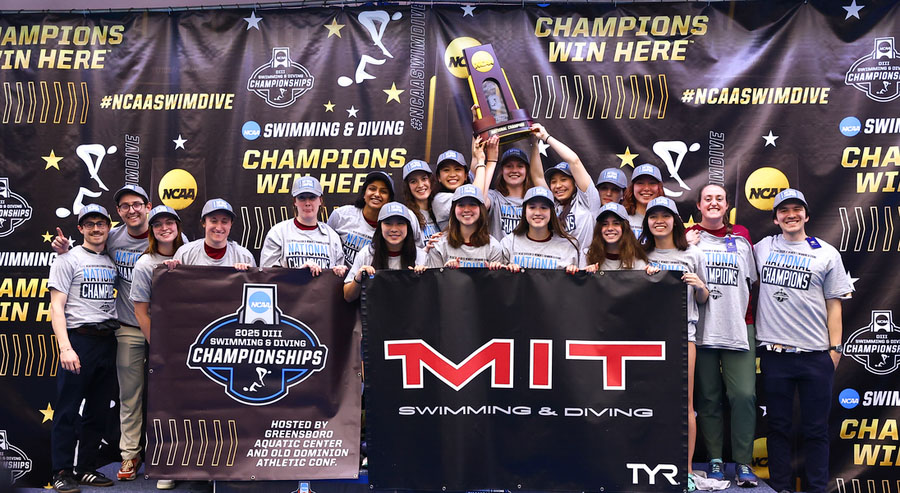 NCAA Division III Swim and Dive Championships champs with trophy and MIT sign