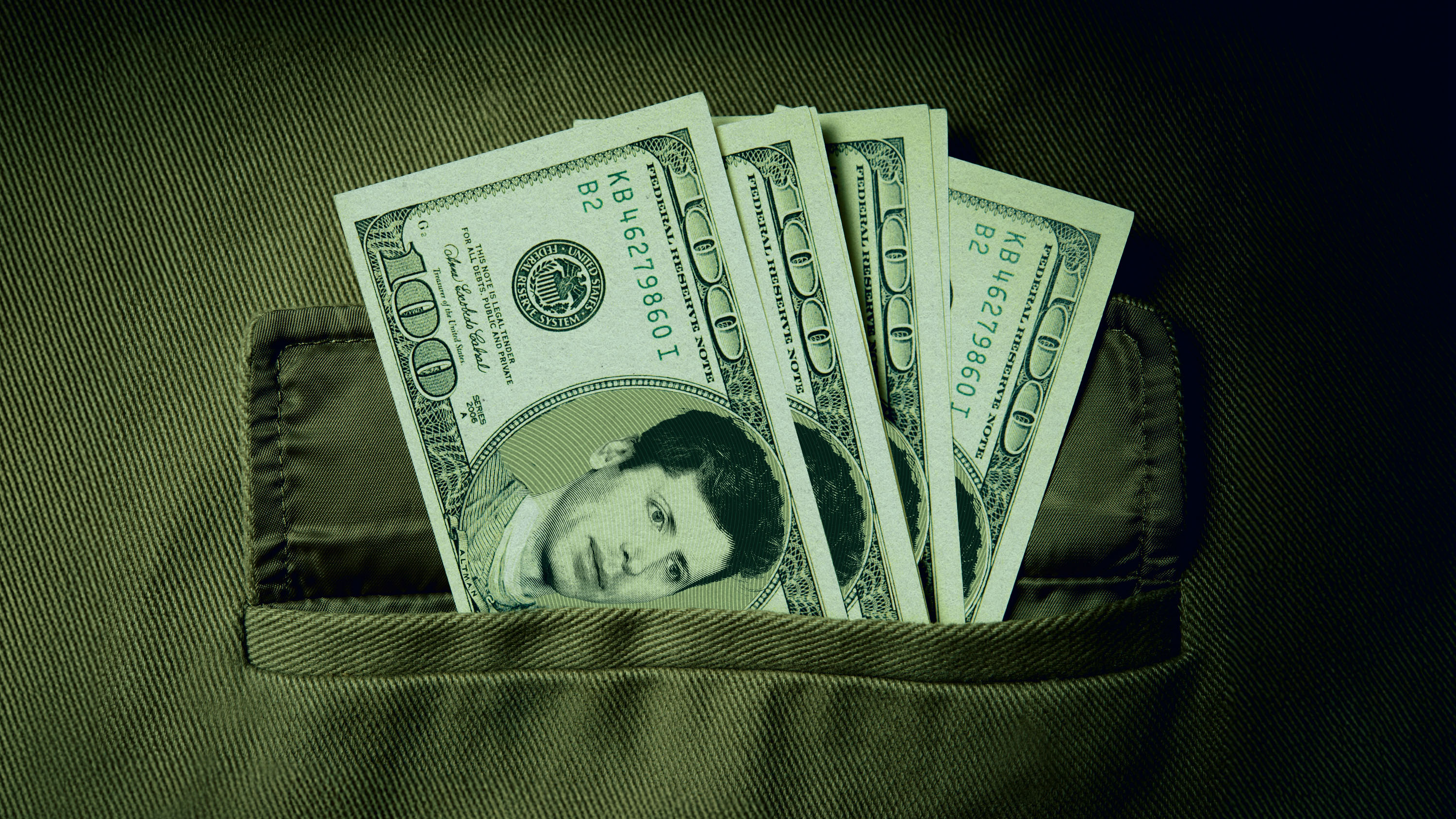 Sam Altman&#039;s face on 100 dollar bills in a pocket